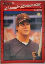 Front of 1990 Donruss DENNIS LEE RASMUSSEN #420, portrait-oriented baseball card front. A red border surrounds a large color portrait of a Padres player in uniform holding a bat. The upper section…