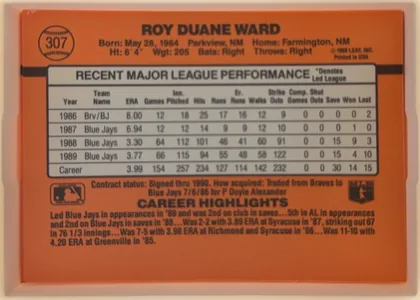 Back of 1990 Donruss Duane Ward #307, landscape-oriented orange baseball-card back. The player name is centered at the top in bold black type. Card number 307 appears inside a baseball…