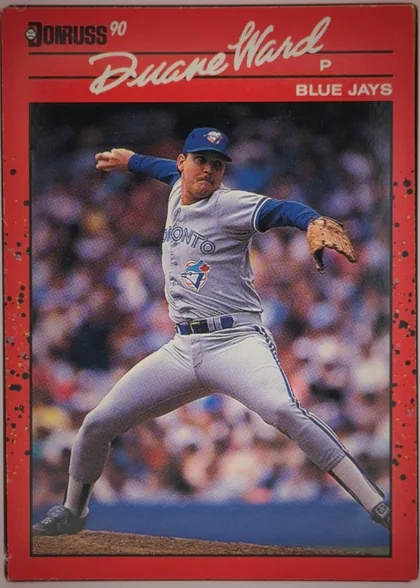Front of 1990 Donruss Duane Ward #307 Base (pack-issued), portrait baseball card front. A large color action photograph shows a Blue Jays pitcher in a throwing stance. The upper red title area contains the…