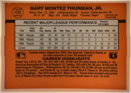 Back of 1990 Donruss Gary Thurman #416, landscape-oriented baseball card back on a solid orange field. Upper left shows a baseball-shaped emblem containing the card number 416. Across the…