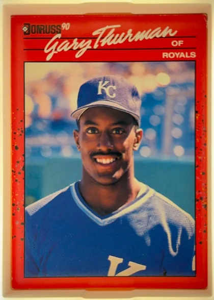 Front of 1990 Donruss Gary Thurman #416, portrait baseball card front. A red, speckled border surrounds a large color portrait of Gary Thurman in a Kansas City Royals uniform. The Donruss…