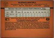 Back of 1990 Donruss Glenallen Hill #627, landscape-oriented orange baseball card back. The player name is centered across the top, with card number 627 in a circular baseball graphic at…