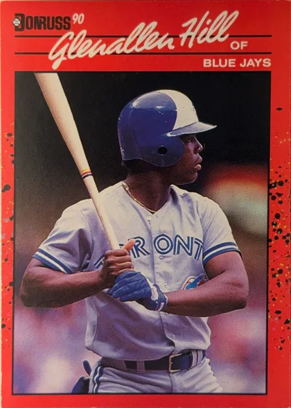 Front of 1990 Donruss GLENALLEN HILL #627, portrait baseball card front. The Donruss logo and "90" appear at the upper left. A large white script player name spans the upper section, with…
