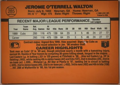 Back of 1990 Donruss Jerome Walton #285, upright landscape-oriented baseball card back. An orange field surrounds a large white statistics panel. The upper-left contains a baseball-shaped…