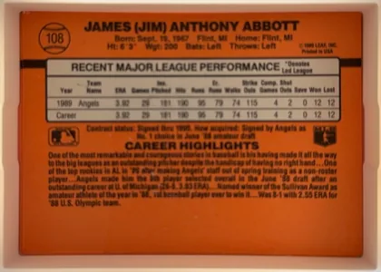 Back of 1990 Donruss Jim Abbott #108, landscape-oriented orange card back. The player name is prominent across the top, with card number 108 inside a baseball graphic at upper left…