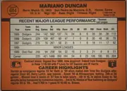 Back of 1990 Donruss Mariano Duncan #684, landscape-oriented baseball card back dominated by an orange field. The upper area has the circular card number 684 at left, the bold player name…