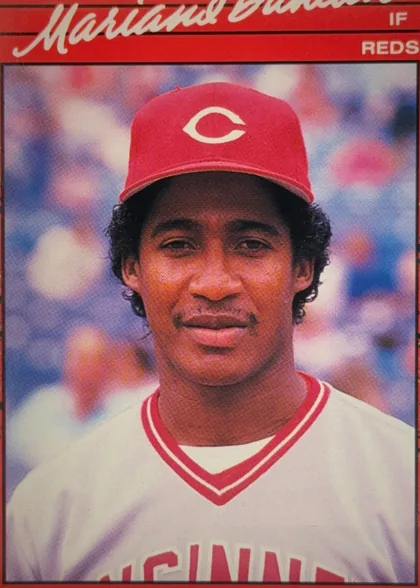 Front of 1990 Donruss Mariano Duncan #684, portrait-oriented baseball card front. A red header at the top contains the large white script name Mariano Duncan, with IF at upper right and REDS…