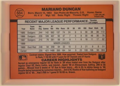 Back of 1990 Donruss Mariano Duncan #684, orange baseball-card back in upright landscape orientation. A baseball-shaped circle containing card number 684 is at the upper left. MARIANO DUNCAN…