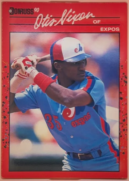 Front of 1990 Donruss Otis Nixon #456, portrait baseball card front. A red border surrounds a large action photograph of Otis Nixon batting in an Expos uniform. The Donruss '90 logo is at…