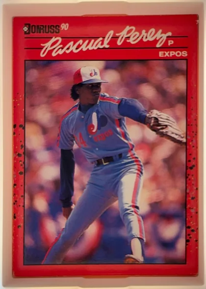 Front of 1990 Donruss Pascual Perez #342, portrait-oriented baseball card front. A red speckled border surrounds a large action photograph of a pitcher in an Expos uniform. The Donruss logo…