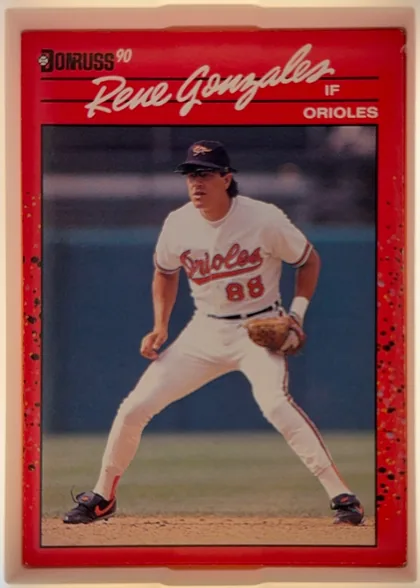 Front of 1990 Donruss Rene Gonzales #401, portrait-oriented baseball card front. A red header contains the Donruss logo and 90 at upper left, the large white script name Rene Gonzales across…