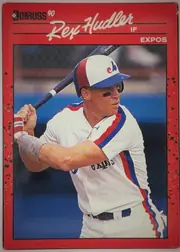 Front of 1990 Donruss Rex Hudler #366, portrait baseball card front. A large color action photograph shows Rex Hudler batting in a Montreal Expos uniform. The upper section has a red…