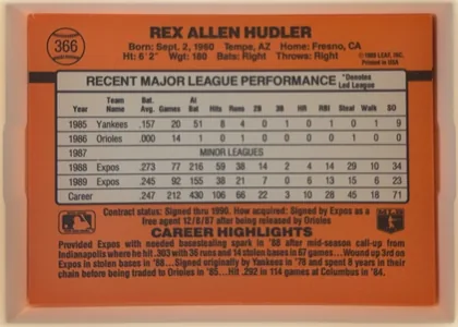 Back of 1990 Donruss Rex Hudler #366, landscape-oriented baseball card back dominated by an orange field. The player's name is centered across the top, with biographical information…