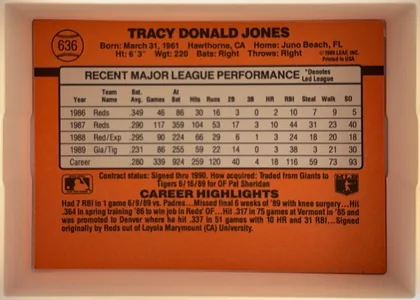 Back of 1990 Donruss Tracy Jones #636, landscape-oriented orange-red baseball card back. The player name Tracy Donald Jones is centered across the top in bold black type. Card number 636…