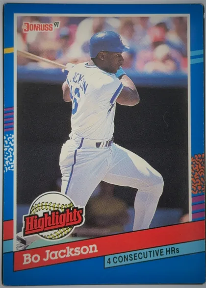 Front of 1991 Donruss Baseball Cards Bo Jackson #BC-10, portrait baseball card front. A large action photograph shows a batter in a white uniform and blue helmet. The Donruss 91 logo is at the upper left…