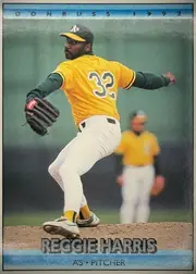 Front of 1991 Donruss Baseball Cards Reginald Allen Harris #781 Base, portrait baseball card front. A right-handed pitcher in an Oakland A's home uniform (yellow jersey with gray number 32, white pants, gray cap with…