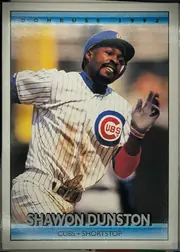 Front of 1991 Donruss Baseball Cards Ron Kittle #613, portrait baseball card front. A large central color action photograph shows a Chicago Cubs player in a white pinstriped uniform and blue cap. The…