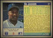 Back of 1991 Score Baseball Cards Bo Jackson #5 Base, back side, portrait layout. A cream outer border frames a dark blue inner rectangle. The left portion shows a color head-and-shoulders portrait of…