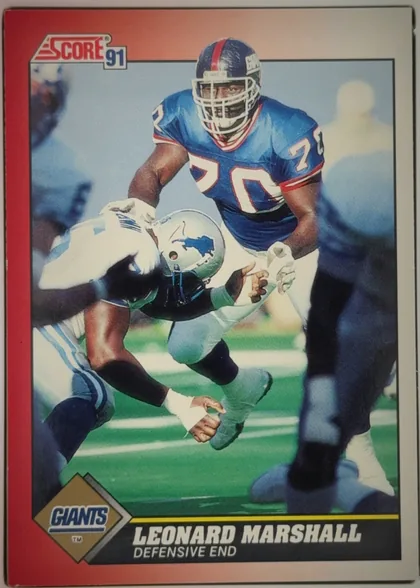 Front of 1991 Score Football Cards LEONARD MARSHALL #170 Base, portrait-oriented football card front. A large action photograph shows a New York Giants player in a blue uniform tackling an opponent. The Score 91…