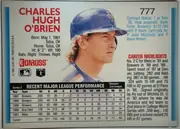 Back of 1992 Donruss Baseball Charlie O'Brien #777 Base, landscape-oriented baseball card back. A large color portrait of Charles Hugh O'Brien occupies the center, with his name in large red type at upper…