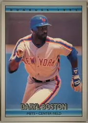 Front of 1992 Donruss Daryl Boston #612, portrait-oriented baseball card front. A large color action photograph shows a New York Mets player running in uniform. The top blue-gradient banner…