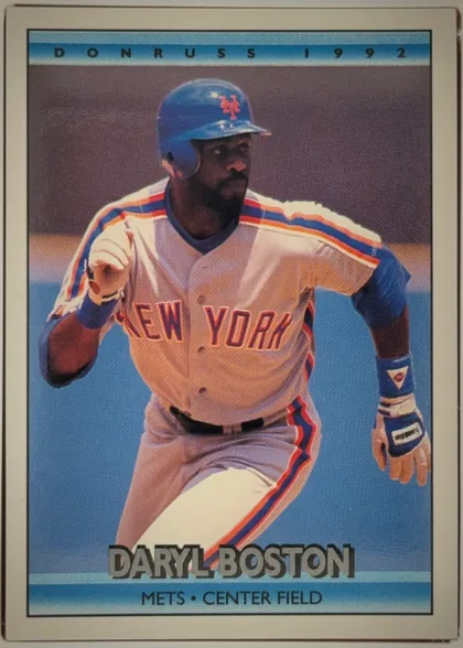 Front of 1992 Donruss Daryl Boston #612, portrait-oriented baseball card front. A large color action photograph shows a New York Mets player running in uniform. The top blue-gradient banner…