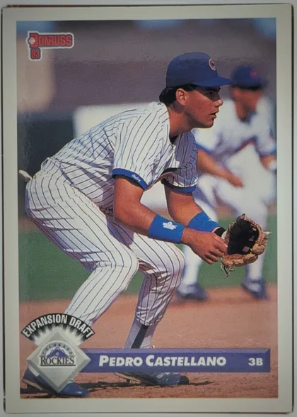 Front of 1993 Donruss Baseball Pedro Castellano #761 Expansion Draft, portrait-oriented baseball card front. A player in a white pinstriped uniform and blue cap is crouched in the field wearing a glove. The Donruss 93…