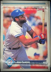 Front of 1993 Donruss JOE CARTER #615 Base, upright portrait baseball card. A batter in a Toronto Blue Jays uniform and blue helmet is shown in profile during a swing. The image has a blurred…