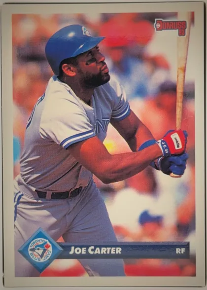 Front of 1993 Donruss JOE CARTER #615 Series 2, portrait-oriented baseball card front. A color action photograph shows Joe Carter batting in a Toronto Blue Jays uniform. The Donruss 93 logo is at…