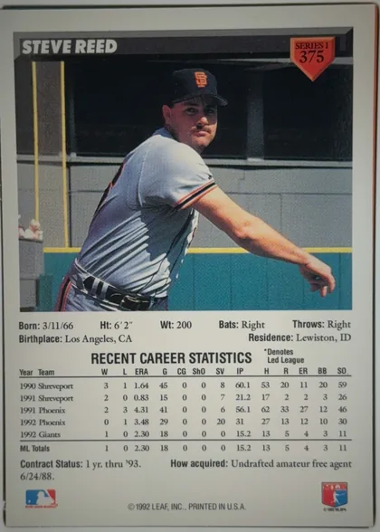 Back of 1993 Donruss Steve Reed #375 Rated Rookie, portrait-oriented baseball card back. A large color action photograph occupies the upper-middle area, showing Steve Reed in a San Francisco Giants…