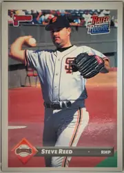 Front of 1993 Donruss Steve Reed #375 Rated Rookie, upright portrait baseball card. A San Francisco Giants pitcher is shown throwing in a stadium. The Donruss 93 logo is at the upper left, Rated…