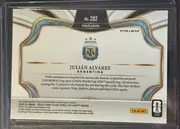 Back of 2022 Panini Select FIFA Julián Alvarez #202 Field Level Prizm, upright landscape-oriented card back. A black textured panel with gold edging at the top contains the centered card number "No. 202" and the…
