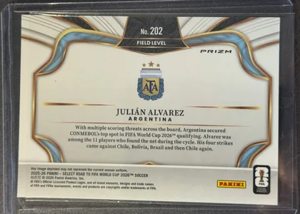 Back of 2022 Panini Select FIFA Julián Alvarez #202 Field Level Prizm, upright landscape-oriented card back. A black textured panel with gold edging at the top contains the centered card number "No. 202" and the…