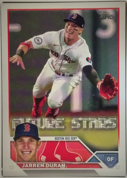 Front of 2023 Topps Jarren Duran #242 Base, upright portrait baseball card front. The Topps logo appears at the upper right. A large action photograph shows a Boston Red Sox player in uniform…
