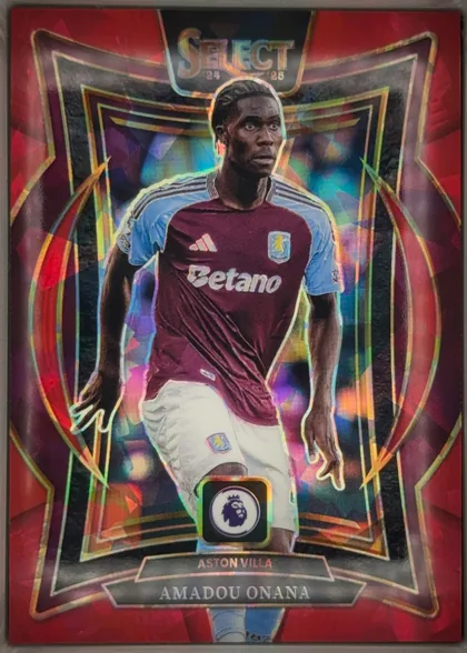 Front of 2024-25 Panini Select Premier League Soccer Amadou Onana #15 Terrace Prizm, front-oriented portrait football card. A large central image shows Amadou Onana in an Aston Villa maroon-and-blue kit, with the Betano sponsor…