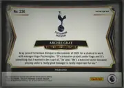 Back of 2024-25 Panini Select Premier League Soccer Archie Gray #236 Rookie Card, landscape-oriented card back with a white central panel framed by black and gold decorative borders. The card number is at the upper left and PRIZM…