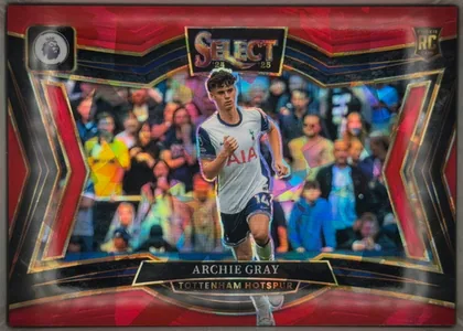 Front of 2024-25 Panini Select Premier League Soccer Archie Gray #236 Rookie Card, upright portrait-format soccer card front. A Tottenham Hotspur player is pictured running in a stadium, centered over a colorful crowd background…