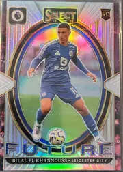 Front of 2024-25 Panini Select Premier League Soccer Bilal El Khannouss #19 Prizm, upright portrait soccer card front. A full-body image of Bilal El Khannouss in a blue Leicester City kit appears in the center, controlling a soccer…