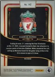 Back of 2024-25 Panini Select Premier League Soccer Darwin Núñez #142 Mezzanine, upright portrait-format card back. A large Liverpool Football Club crest is centered in the upper half on a black background. The player name DARWIN…