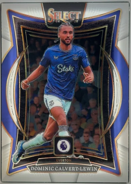 Front of 2024-25 Panini Select Premier League Soccer Dominic Calvert-Lewin #59 Base Terrace, portrait soccer card front. The SELECT 24-25 logo is centered at the top. Dominic Calvert-Lewin is shown running in an Everton blue kit against a…