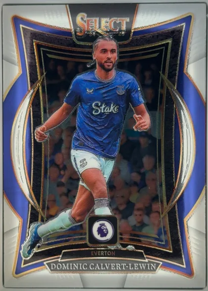 Front of 2024-25 Panini Select Premier League Soccer Dominic Calvert-Lewin #59 Terrace, upright portrait soccer card. The upper portion has a large SELECT logo over a dark panel. Dominic Calvert-Lewin is shown running in an Everton blue…