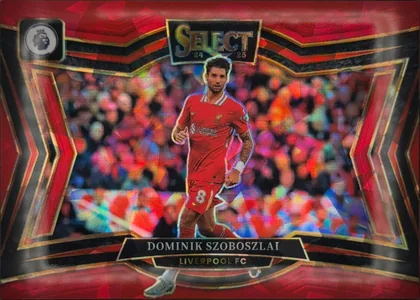 Front of 2024-25 Panini Select Premier League Soccer Dominik Szoboszlai #219 Field Level, upright portrait-oriented soccer card front. A red, black, and gold geometric design frames a central action image of Dominik Szoboszlai in a red…