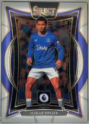 Front of 2024-25 Panini Select Premier League Soccer Iliman Ndiaye #58, upright portrait soccer card front. A central image shows Iliman Ndiaye in an Everton blue kit, with the sponsor text "Stake" visible on the shirt…