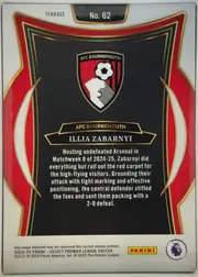 Back of 2024-25 Panini Select Premier League Soccer Illia Zabarnyi #62, upright portrait-oriented card back. A white top and bottom field surrounds a black central panel framed by layered gold lines, red side panels, and…