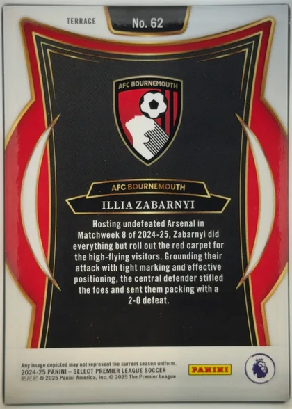 Back of 2024-25 Panini Select Premier League Soccer Illia Zabarnyi #62, upright portrait-oriented card back. A white top and bottom field surrounds a black central panel framed by layered gold lines, red side panels, and…