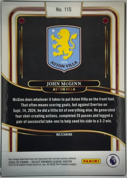Back of 2024-25 Panini Select Premier League Soccer John McGinn #115 Mezzanine, upright portrait-oriented card back. A black field is framed by sweeping gold, burgundy, and white curved bands. The Aston Villa crest is centered…