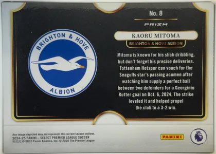 Back of 2024-25 Panini Select Premier League Soccer Kaoru Mitoma #8 Prizm, back of a soccer card with a predominantly black field and gold ornamental border. A large Brighton & Hove Albion crest occupies the left side. On…