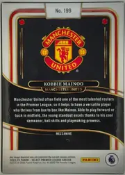 Back of 2024-25 Panini Select Premier League Soccer Kobbie Mainoo #199 Mezzanine, landscape-oriented card back with a white border and ornate red, gold, black, and cream framing. The Manchester United crest occupies the upper…