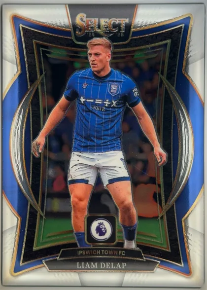 Front of 2024-25 Panini Select Premier League Soccer LIAM DELAP #20, front of a portrait football card. A footballer in a blue Ipswich Town FC kit is pictured centrally. The top has a large SELECT title with 24 and 25…