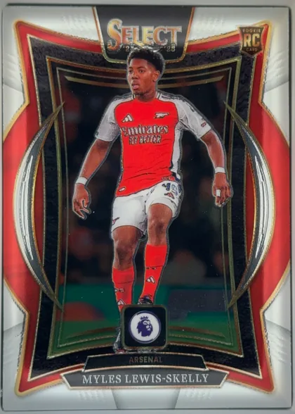 Front of 2024-25 Panini Select Premier League Soccer Myles Lewis-Skelly #31 Terrace, front-facing portrait soccer card. A full-body image of Myles Lewis-Skelly in an Arsenal red-and-white kit is centered within a dark recessed-style…